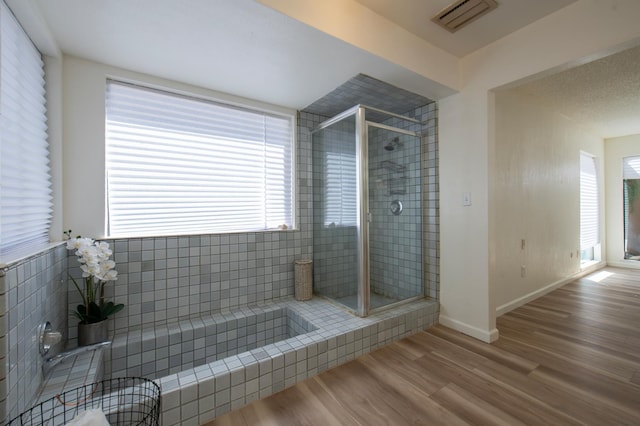 1535 S Homsy Ave, Fresno, CA 93727 - full bathroom with a stall shower and wood finished floors