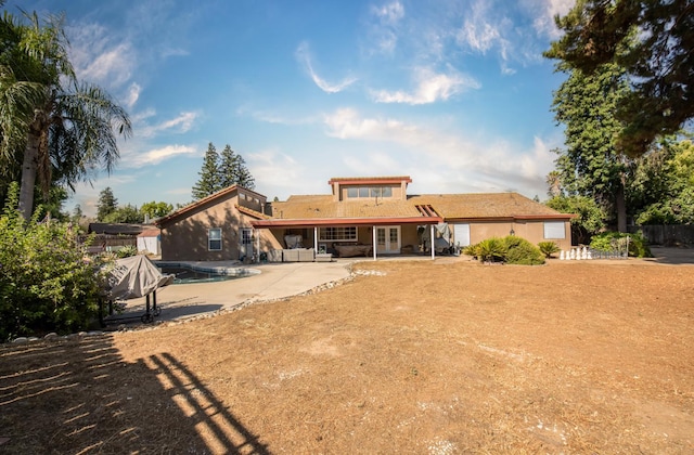 1535 S Homsy Ave, Fresno, CA 93727 - back of property featuring french doors and a patio area