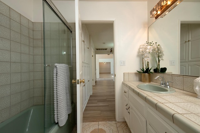 1535 S Homsy Ave, Fresno, CA 93727 - full bath with vanity, tile patterned flooring, and shower / bath combination with glass door
