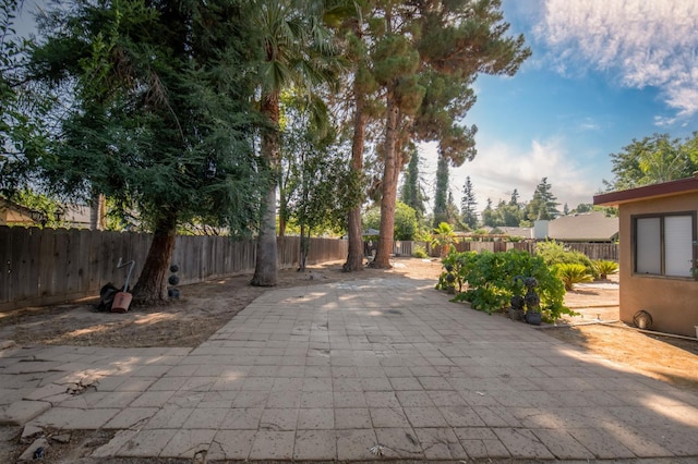 1535 S Homsy Ave, Fresno, CA 93727 - fenced backyard with a patio area