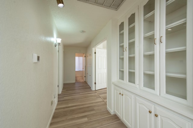 1535 S Homsy Ave, Fresno, CA 93727 - hall featuring light wood-type flooring and baseboards