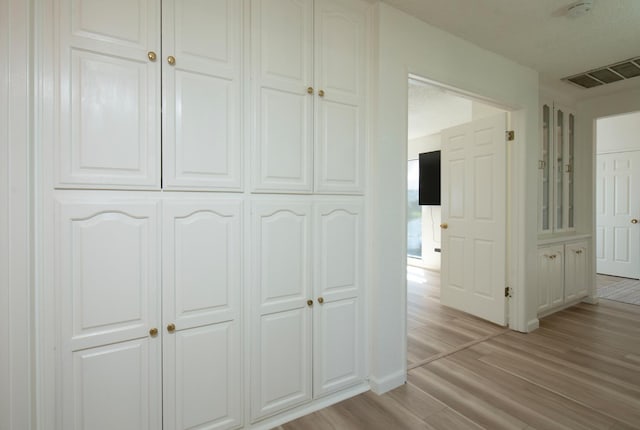 1535 S Homsy Ave, Fresno, CA 93727 - corridor with light wood-style floors