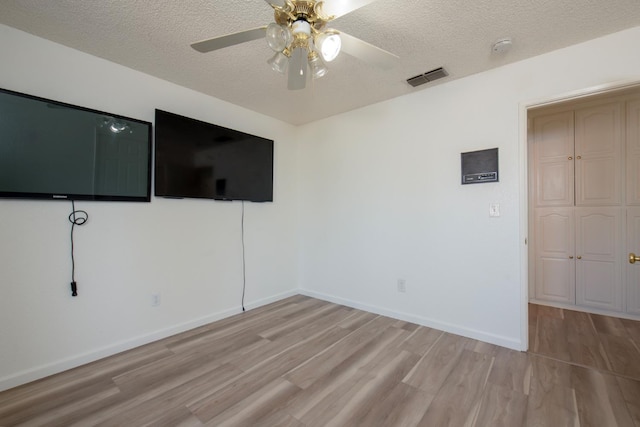 1535 S Homsy Ave, Fresno, CA 93727 - empty room with ceiling fan, a textured ceiling, and light wood-style flooring