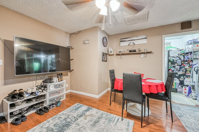 5400 Amber Ave, Clovis, CA 93619 - dining space with a ceiling fan, wood finished floors, and a textured ceiling