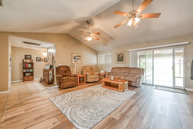 5400 Amber Ave, Clovis, CA 93619 - living area with wood finished floors, ceiling fan, lofted ceiling, and a textured ceiling