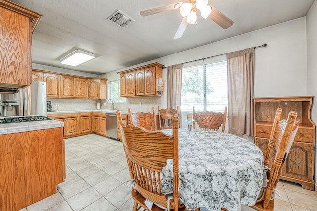 5400 Amber Ave, Clovis, CA 93619 - dining room featuring ceiling fan and light tile patterned flooring