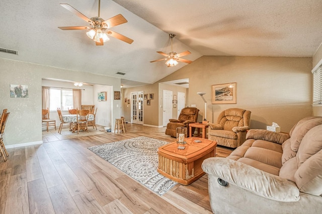5400 Amber Ave, Clovis, CA 93619 - living area with a ceiling fan, vaulted ceiling, a textured ceiling, and wood finished floors