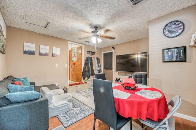 5400 Amber Ave, Clovis, CA 93619 - dining area with wood finished floors, ceiling fan, and a textured ceiling