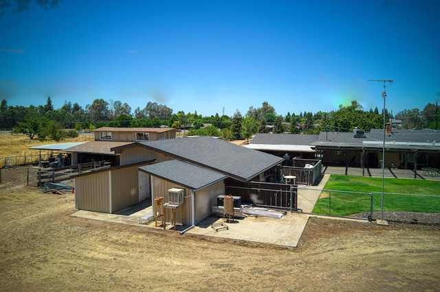 5400 Amber Ave, Clovis, CA 93619 - back of house featuring an outdoor structure and view of scattered trees