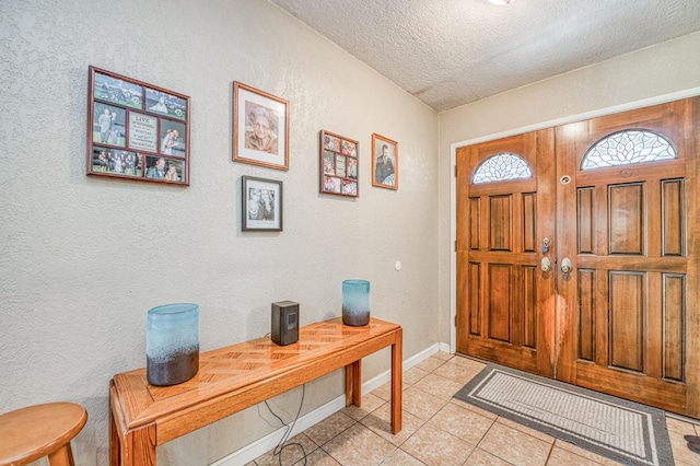 5400 Amber Ave, Clovis, CA 93619 - foyer featuring a textured ceiling, a textured wall, and light tile patterned floors
