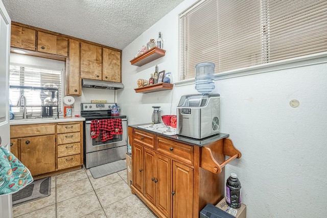 5400 Amber Ave, Clovis, CA 93619 - kitchen with electric stove, under cabinet range hood, brown cabinetry, open shelves, and light tile patterned floors