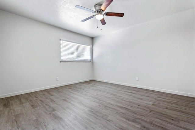 2044 Mayfair Dr W, Fresno, CA 93703 - spare room with wood finished floors and a ceiling fan