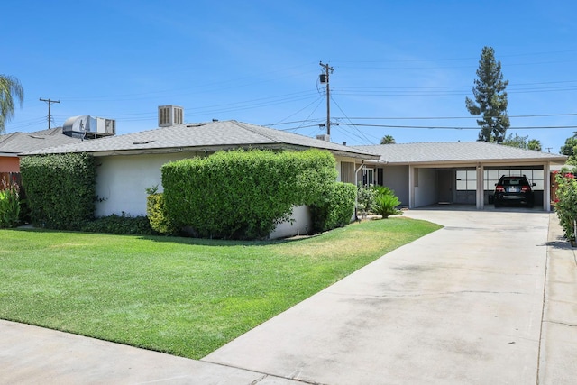 2044 Mayfair Dr W, Fresno, CA 93703 - view of home's exterior with a yard, stucco siding, and driveway