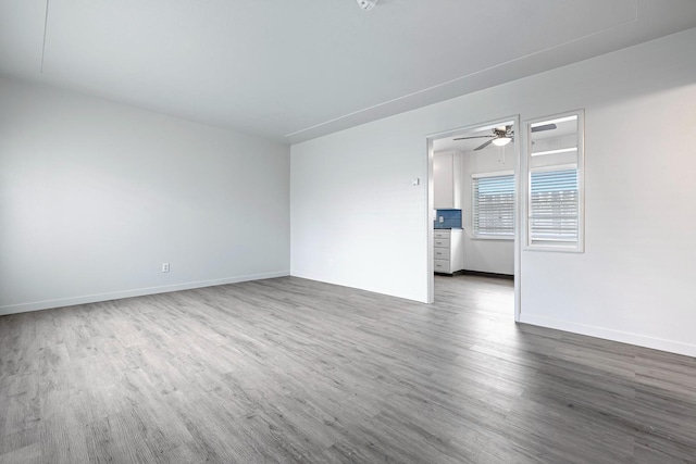 2044 Mayfair Dr W, Fresno, CA 93703 - empty room with dark wood finished floors and a ceiling fan