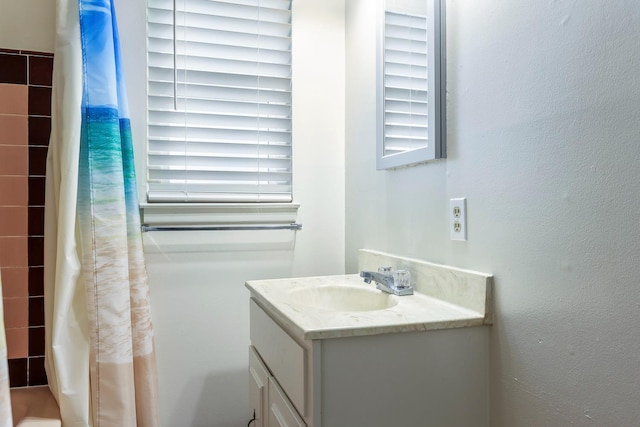 2044 Mayfair Dr W, Fresno, CA 93703 - bathroom with vanity, healthy amount of natural light, and shower / bathtub combination with curtain