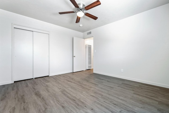 2044 Mayfair Dr W, Fresno, CA 93703 - unfurnished bedroom featuring wood finished floors, a closet, and ceiling fan