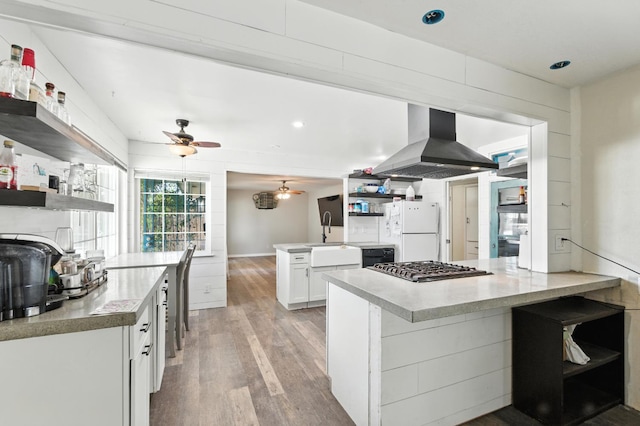 4625 E Princeton Ave, Fresno, CA 93703 - kitchen with open shelves, island exhaust hood, freestanding refrigerator, a peninsula, and a ceiling fan