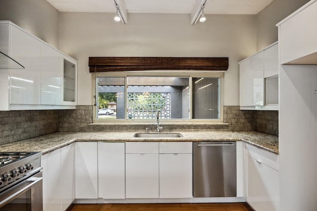 1095 W San Ramon Ave, Fresno, CA 93711 - kitchen featuring appliances with stainless steel finishes, track lighting, white cabinetry, and modern cabinets