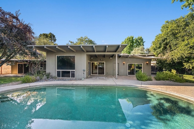 1095 W San Ramon Ave, Fresno, CA 93711 - rear view of property with an outdoor pool and a patio