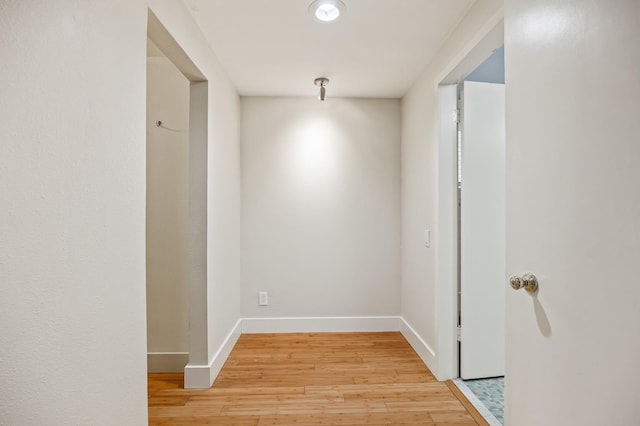 1095 W San Ramon Ave, Fresno, CA 93711 - hallway with light wood-style floors and baseboards