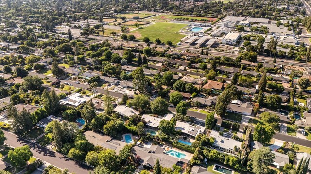 1095 W San Ramon Ave, Fresno, CA 93711 - aerial view of property and surrounding area with nearby suburban area and a pool area