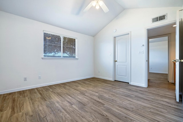 5137 W Stuart Ave, Fresno, CA 93722 - unfurnished bedroom featuring wood finished floors, vaulted ceiling, and a ceiling fan