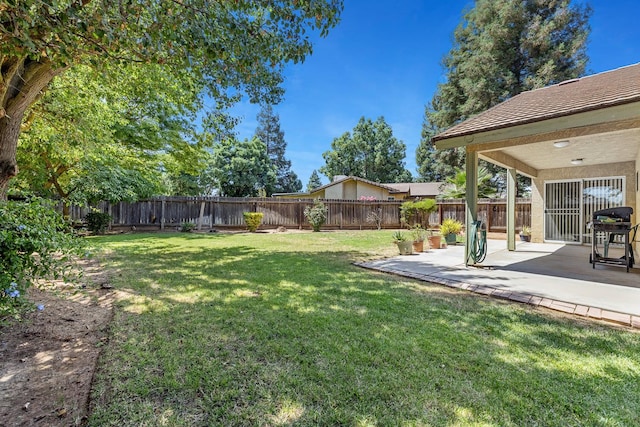 5137 W Stuart Ave, Fresno, CA 93722 - fenced backyard featuring a patio area