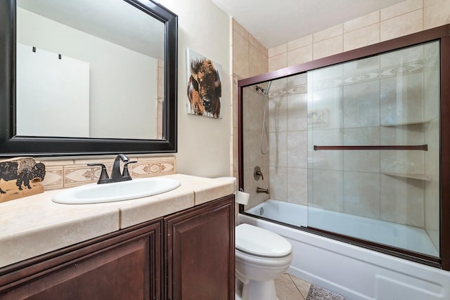 317 W Sierra Ave Unit 107, Fresno, CA 93704 - bathroom featuring vanity, bath / shower combo with glass door, and tile patterned flooring