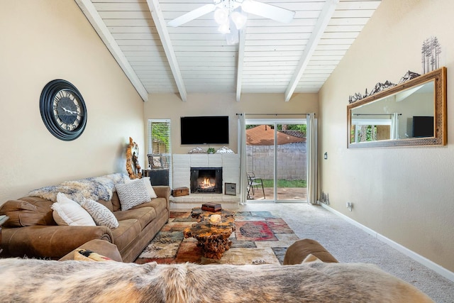 317 W Sierra Ave Unit 107, Fresno, CA 93704 - living room with carpet floors, ceiling fan, a warm lit fireplace, and plenty of natural light