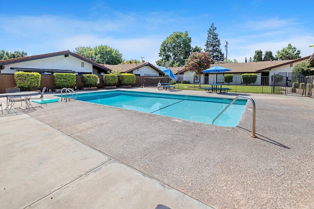 317 W Sierra Ave Unit 107, Fresno, CA 93704 - view of swimming pool featuring a patio