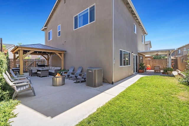 4053 Rialto Ave, Clovis, CA 93619 - rear view of property with an outdoor living space with a fire pit, a patio, a gazebo, and stucco siding