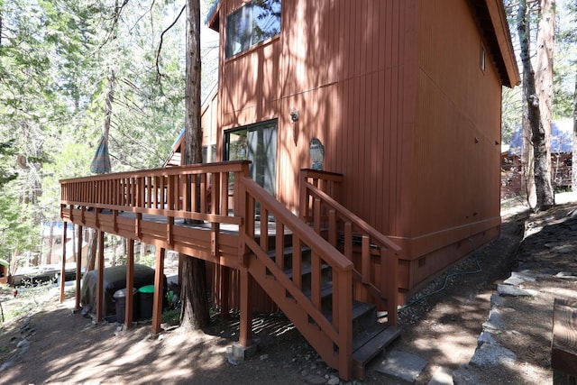42045 Jeffrey Ln, Shaver Lake, CA 93664 - view of home's exterior featuring a deck, stairway, and crawl space