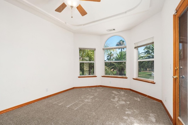 7207 E Bremer Ave, Fresno, CA 93737 - unfurnished room featuring carpet floors, ceiling fan, and a tray ceiling