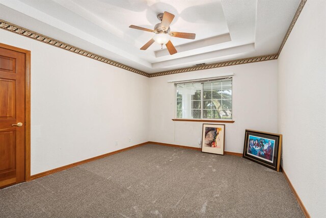7207 E Bremer Ave, Fresno, CA 93737 - spare room featuring carpet, a tray ceiling, and a ceiling fan