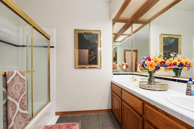 7207 E Bremer Ave, Fresno, CA 93737 - full bathroom featuring double vanity and shower / bath combination with glass door