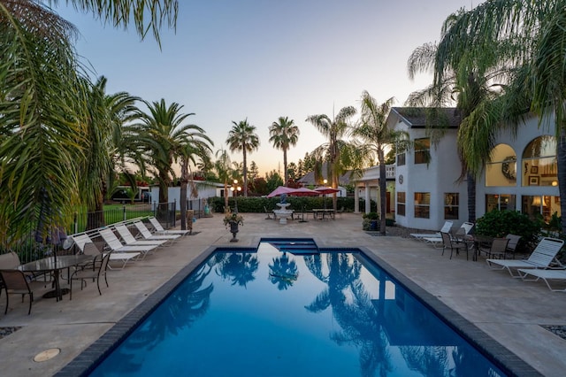 7207 E Bremer Ave, Fresno, CA 93737 - pool at dusk featuring a patio area and a community pool