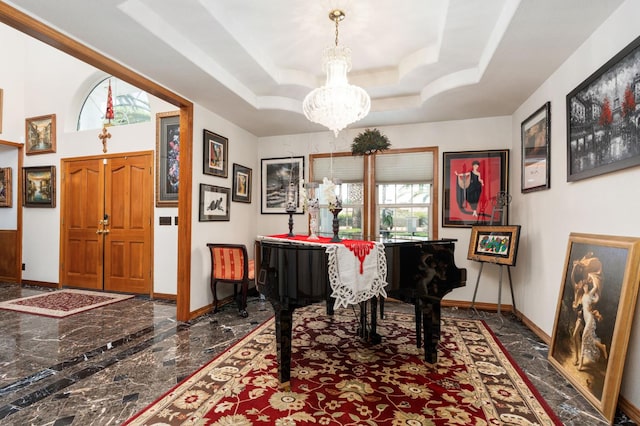 7207 E Bremer Ave, Fresno, CA 93737 - entrance foyer with dark marble finish floors, a chandelier, and a tray ceiling