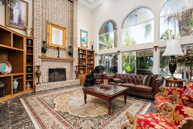 7207 E Bremer Ave, Fresno, CA 93737 - living area with a towering ceiling, marble tiled flooring, and a fireplace