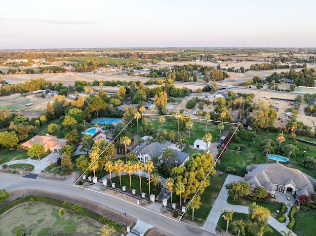 7207 E Bremer Ave, Fresno, CA 93737 - aerial perspective of suburban area featuring property parcel outlined