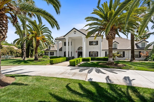 7207 E Bremer Ave, Fresno, CA 93737 - neoclassical home featuring a front lawn