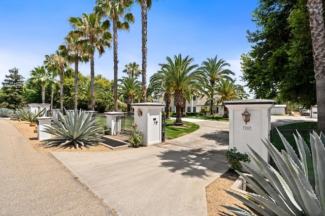 7207 E Bremer Ave, Fresno, CA 93737 - view of concrete driveway featuring a gate