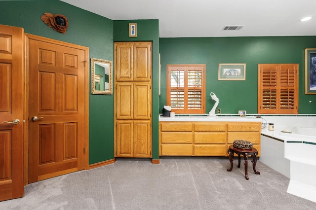 7207 E Bremer Ave, Fresno, CA 93737 - bathroom with a bath and carpet flooring