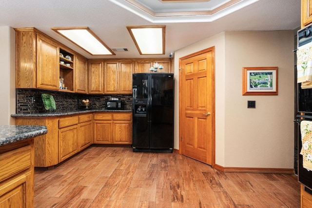 7207 E Bremer Ave, Fresno, CA 93737 - kitchen featuring black appliances, brown cabinetry, tasteful backsplash, and light wood finished floors
