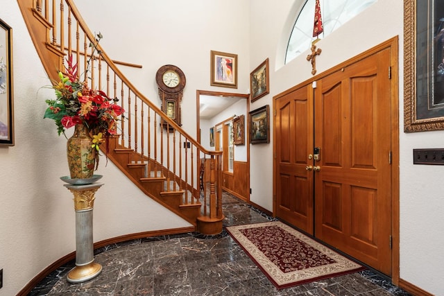7207 E Bremer Ave, Fresno, CA 93737 - entrance foyer featuring a high ceiling, stairs, and marble finish floors