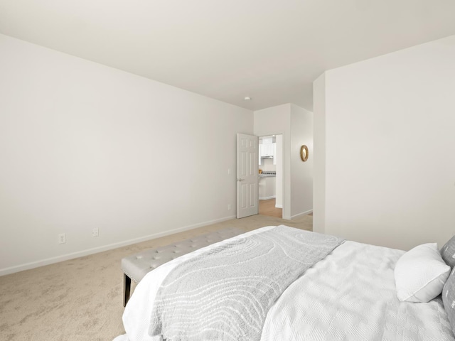 2303 S Bush Ave, Fresno, CA 93727 - bedroom with baseboards and light carpet