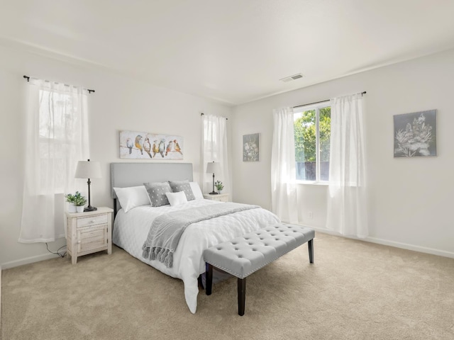 2303 S Bush Ave, Fresno, CA 93727 - bedroom featuring light colored carpet and baseboards