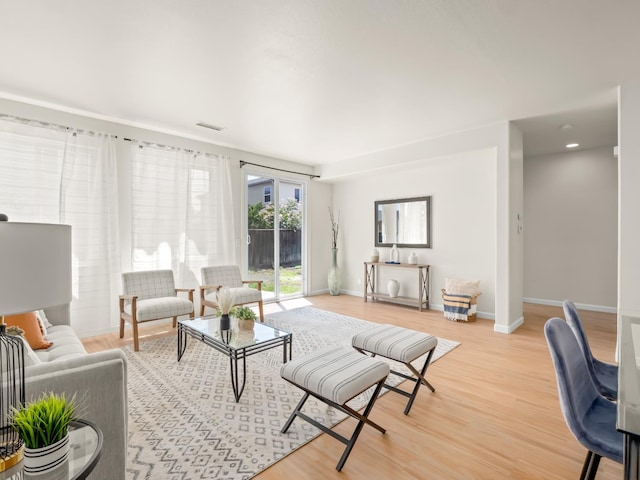2303 S Bush Ave, Fresno, CA 93727 - living room with light wood-style floors and baseboards