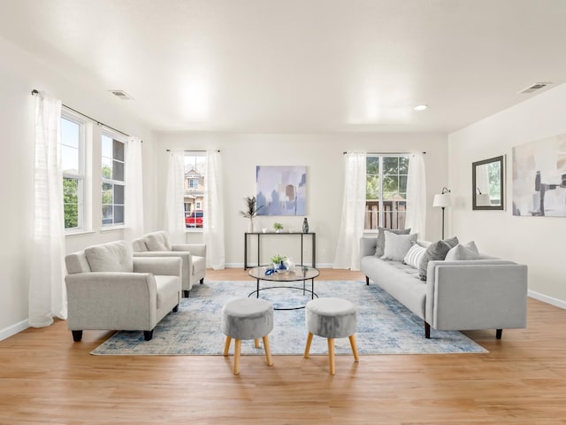 2303 S Bush Ave, Fresno, CA 93727 - living area featuring light wood finished floors and recessed lighting