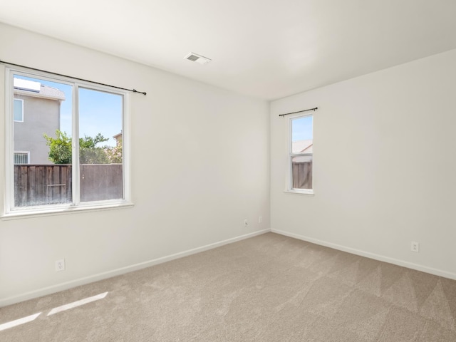 2303 S Bush Ave, Fresno, CA 93727 - carpeted empty room with baseboards
