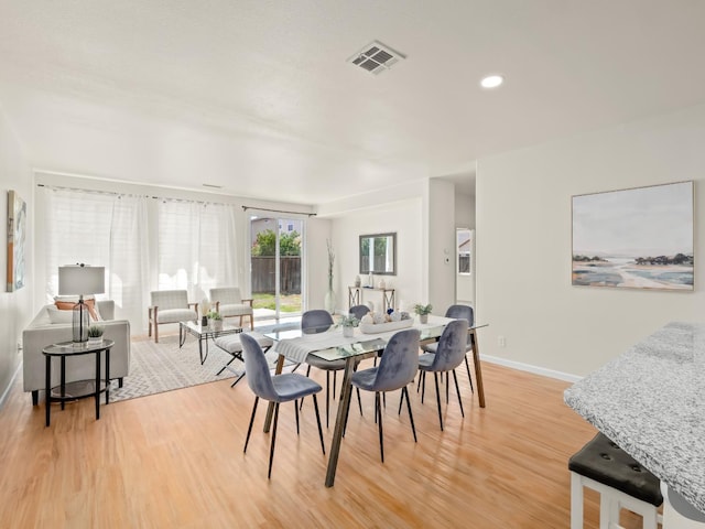2303 S Bush Ave, Fresno, CA 93727 - dining area featuring light wood-type flooring and recessed lighting